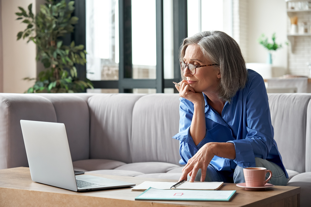 woman researching cost of a good facelift near Georgetown