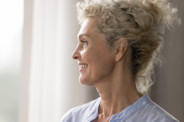 woman with natural results from a facelift with Dr. Hopping